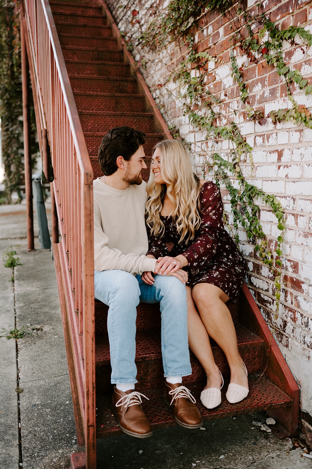 Couple embracing for engagement photos